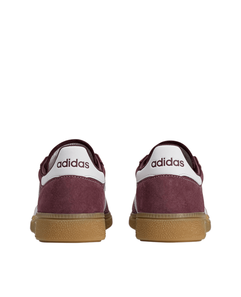 Rear view of adidas x Sporty & Rich Handball Spezial sneakers in Shadow Red suede with gum soles.