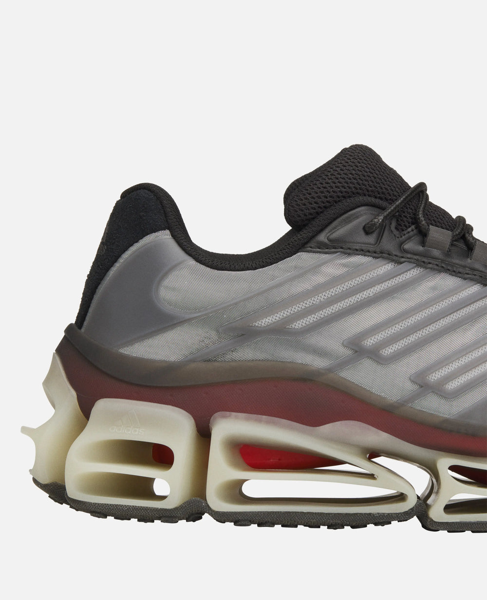 Close-up of Adidas Chavarria Megaride sneaker detailing the sculpted midsole and grey mesh upper.