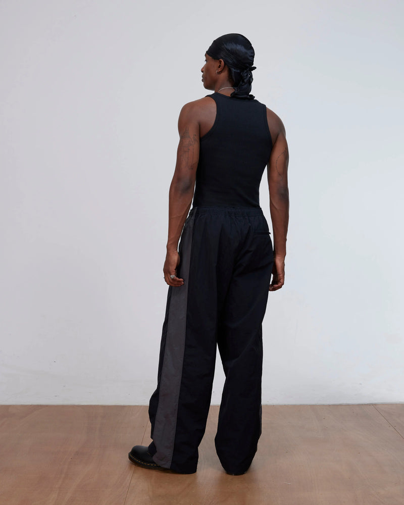 Patta Panelled Oversized Track Pants (Black) Patta